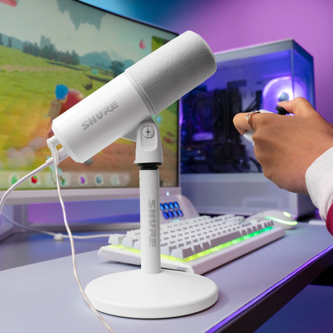 Shure MV6 Gen 2 White on a gaming desk in front of a PC and monitor