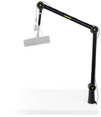 Shure SH-BROADCAST1 broadcast microphone arm mounted on a desk with microphone attached for studio broadcasting setup.