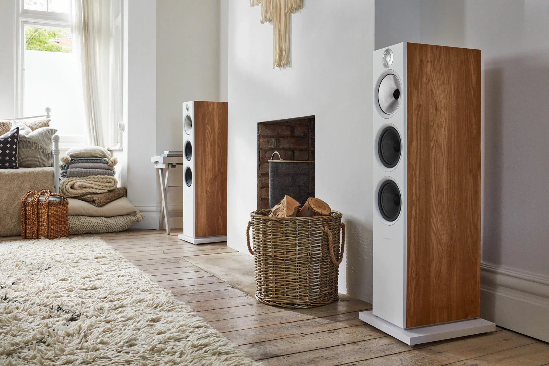 Bowers & Wilkins 603 S3 passive floorstanding speakers with sleek black cabinets and stylish grille in a modern living room setting