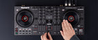 Numark NS4FX DJ controller with sliders, knobs, and jog wheels for professional mixing and music performance.