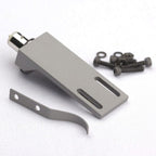 Tonar Headshell Top Q for cartridge accessories, close-up of black headshell with mounting hardware on a turntable.