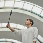 Ricoh Theta X 360-degree video camera with dual lenses and sleek design, ideal for immersive virtual reality content creation.