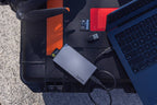 Lexar Workflow SD and microSD UHS-II card reader connected to a computer with multiple memory cards inserted for data transfer.
