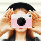 Kodak Printomatic instant compact camera with colorful design and lens, ready to capture and print photos instantly.