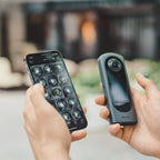 Ricoh Theta X 360-degree video camera with dual lenses and ergonomic design, ready for high-quality immersive video recording.