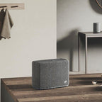 Audio Pro A15 portable speaker with sleek black design, compact size, and built-in controls for high-quality sound.