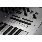 Korg Minilogue synthesizer with a compact design, featuring knobs and controls for creating diverse sounds and music production.