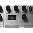 Korg Minilogue synthesizer with knobs and controls, compact digital keyboard for music production and sound creation.