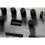 Korg Minilogue synthesizer with control knobs and keyboard, showing its compact design and front panel features.
