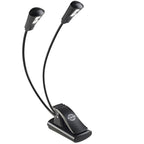 K&M 12244 music stand light attached to a music stand, adjustable LED light with flexible arm for sheet music illumination.