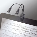 K&M 12244 music stand light attached to a music stand, adjustable LED lamp for sheet music illumination.