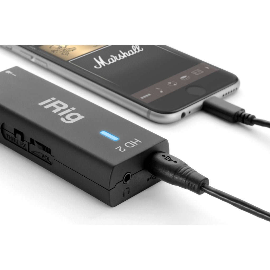 IK Multimedia iRig HD 2 guitar audio interface with USB cable and control knobs on a white background.