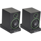 Gator Studio Monitor Isolation Pads placed on studio monitor stands, designed to reduce vibrations and improve sound quality.
