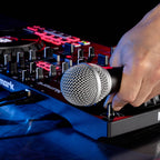 Numark Mixtrack Platinum FX DJ controller with jog wheels, faders, and controls for digital DJing on a sleek black design.