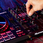 Numark Mixtrack Platinum FX DJ controller with jog wheels, faders, and control knobs for digital music mixing.