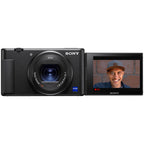 Sony ZV-1 video camera with compact design, front view showing lens and controls, ideal for vlogging and high-quality video recording.