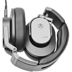 Austrian Audio Hi-X55 studio headphones with over-ear design and black ear cups, resting on a white background.