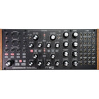 Moog Subharmonicon synthesizer with control knobs and patch points, featuring a sleek black and gold design.