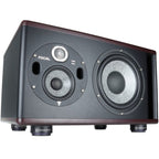 IsoAcoustics ISO-Puck 76 studio monitor stand isolator on a flat surface, designed to improve speaker sound quality.
