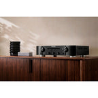 Marantz PM6007 stereo amplifier with sleek black finish, front panel controls, and input selection buttons.