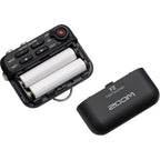 Zoom F2 digital recorder with compact design and multiple input options, shown with attached microphone and controls.