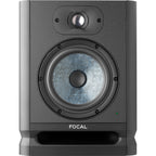 Focal Alpha 65 Evo active nearfield monitors, two black studio speakers with control knobs and ports, on a wooden surface.