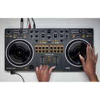 Black Pioneer DJ DDJ-REV1 DJ controller with jog wheels, mixer controls, and performance pads for professional DJ setup.