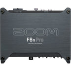 Zoom F8n Pro digital recorder with multiple input channels and a sleek design, displayed on a wooden surface.