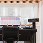 Adam Audio A44H mid-field and main monitors shown on a studio desk with clean white background.