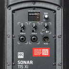 HK Audio SONAR 115 Xi active loudspeaker with a black enclosure, featuring dual speaker drivers and professional audio connectors.