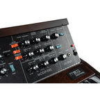 Moog Minimoog Model D synthesizer with vintage-style controls and keyboard, highlighting its classic design and hardware interface.