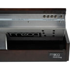 Moog Minimoog Model D synthesizer with black control panel and vintage-style knobs, set on a wooden stand.