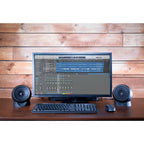 Pair of Kali Audio IN-UNF studio monitors with subwoofer in a professional recording studio setup.