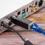 SilentPower LAN iSilencer noise filter and conditioner with sleek design, showing ports and connectors in clear view.