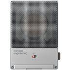 Teenage Engineering CM-15 condenser microphone shown with sleek metal body and professional audio input for recording.