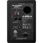 M-Audio BX3 BT desktop speakers showing black speaker cabinets with control knobs and Bluetooth connectivity.