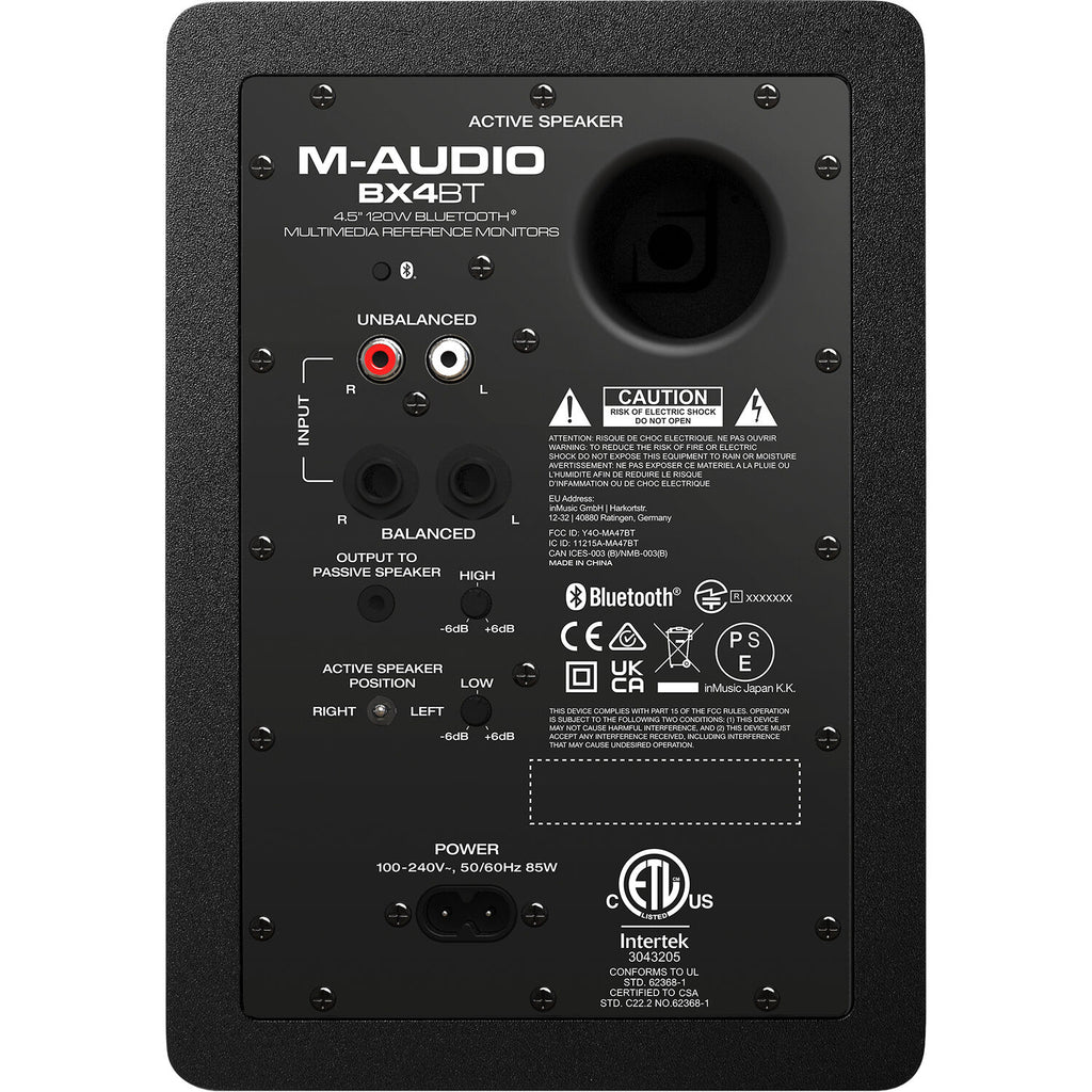M-Audio BX4 BT desktop speakers with black finish and control knobs on the front panel.