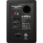 M-Audio BX4 BT desktop speakers with black finish and control knobs on the front panel.