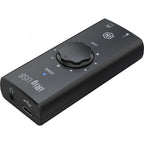 IK Multimedia iRig USB audio interface connected to a computer, showing input ports and compact design for mobile recording.