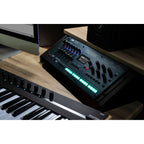Korg Opsix synthesizer module with colorful control knobs and interface, designed for electronic music production.