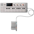 Teenage Engineering OP-1 Field synthesizer with compact design, colorful controls, and built-in screen for music production.