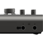 Audient iD44 MK2 audio interface with multiple input/output ports and sleek black design, used on a desk setup.