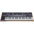 Sequential Trigon-6 synthesizer with multiple knobs and buttons, showing its compact electronic keyboard layout.