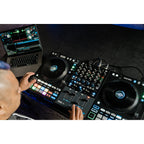 Rane Four DJ controller with jog wheels, mixer controls, and performance pads, designed for professional DJ setups.