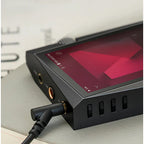 Astell&Kern A&norma SR35 portable music player in black, showing the front display and control buttons.