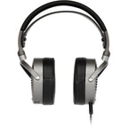Audeze MM-100 studio headphones with over-ear design and plush ear cushions, shown on a neutral background.