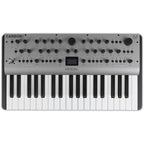 Modal Electronics Carbon8 keyboard synthesizer with black and silver design, featuring control knobs and input/output ports.