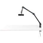 Shure SH-BROADCAST1 broadcast microphone arm mounted on a desk with microphone attached for professional audio recording setup
