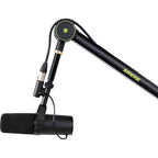 Shure SH-BROADCAST1 broadcast microphone arm mounted on a desk with adjustable arm and shock mount for professional audio recording.