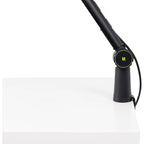 Shure SH-BROADCAST1 broadcast microphone arm mounted on a desk with microphone attached for professional audio recording setup